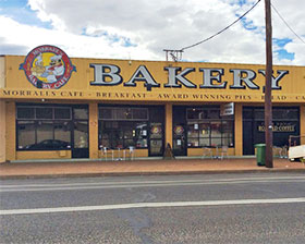 The yellow façade of Morralls bakery and café